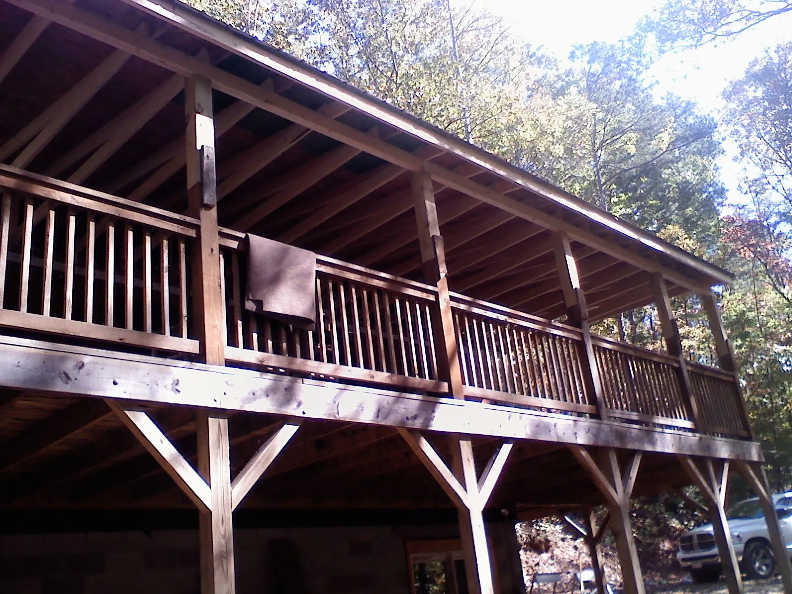 Timber framing under a new elevated porch and deck in Sedalia